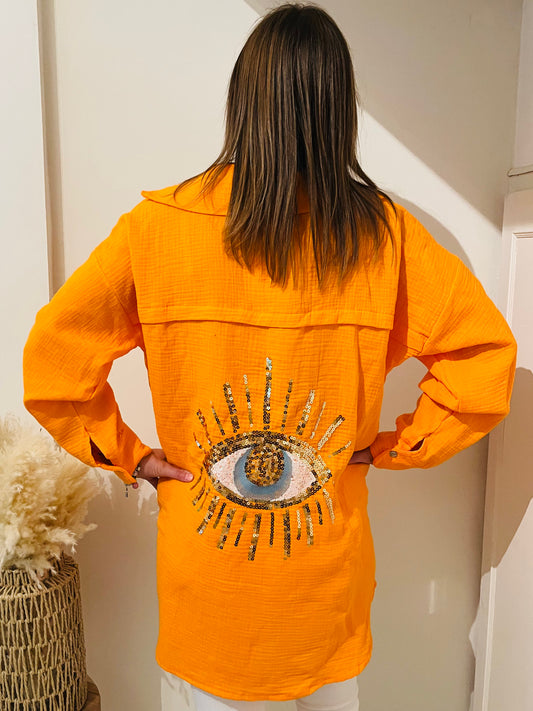 chemise orange oeil femme
